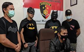 Real police officers discussing the state actor problem and is Batman a vigilante or hero.
