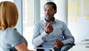 An employee confidently negotiating a better severance package with HR.